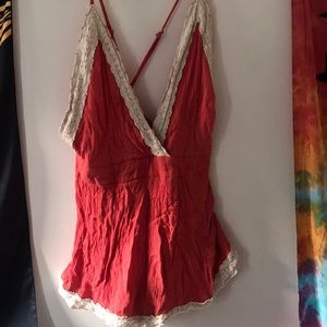 Low cross back coral romper.
